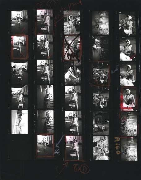Bob Willoughby Audrey Hepburn riding her bicycle on the set of "My Fair Lady" with her dog Assam (Contact Sheet), 1963    
