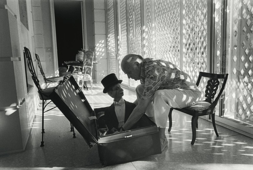 Edgar Bergen takes Charlie McCarthy out of his suitcase, Los Angeles, California, 1978, Silver Gelatin Photograph