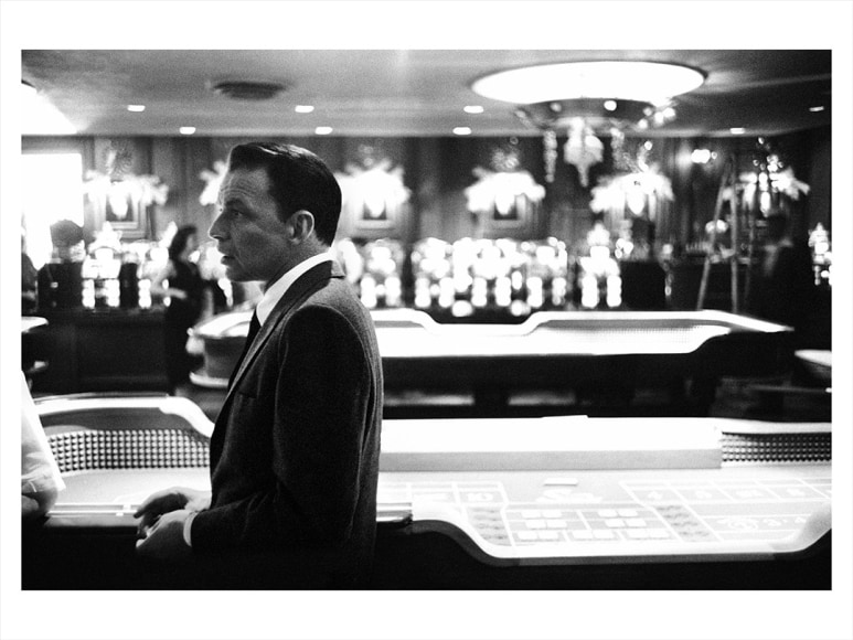 Frank Sinatra inside Casino, gaming tables behind, during the filming of ”Ocean's 11”, Las Vegas, 1960, Archival Pigment Print