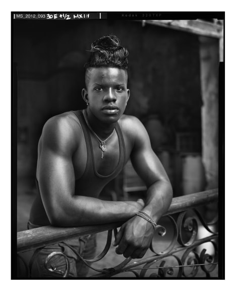 Man Standing on Balcony, Havana, Cuba,&nbsp;2012, 20 x 16 inches, Silver Gelatin Photograph, Ed. of 25