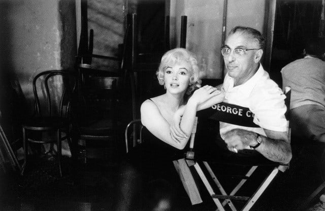 Marilyn Monroe and director George Cukor chat on the set of "Let’s Make Love", 1960, Archival Pigment Print