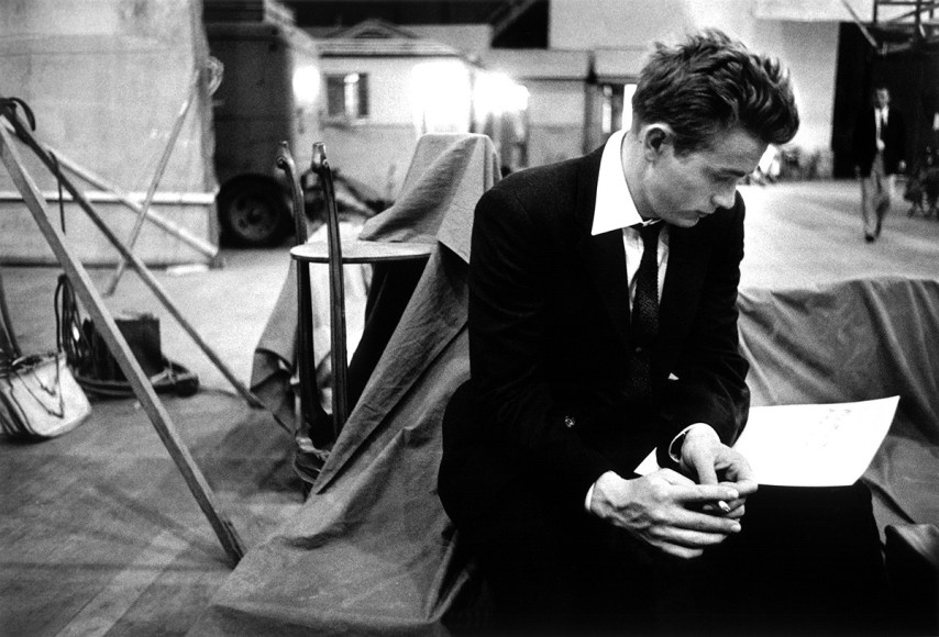 James Dean looks over a music score on the set of "Rebel Without a Cause", 1955, Archival Pigment Print
