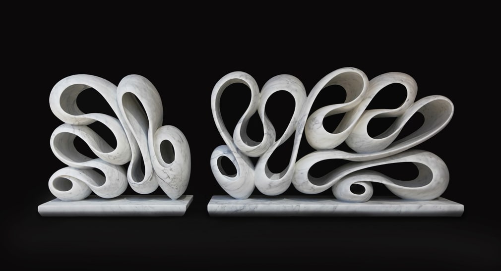 a large hand-carved white marble sculpture in two-parts, one of which is 24 x 40 x 12 1/4 inches and one of which is 24 x 24 x 12 1/4 inches