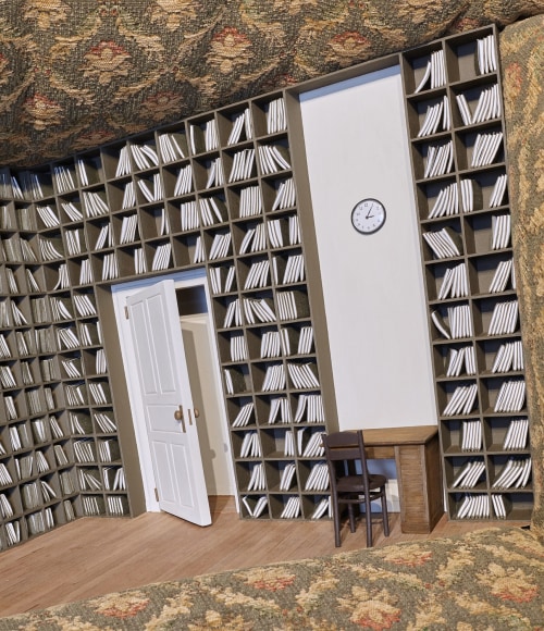 a sculpture of an armchair with a tiny library hidden in its seat