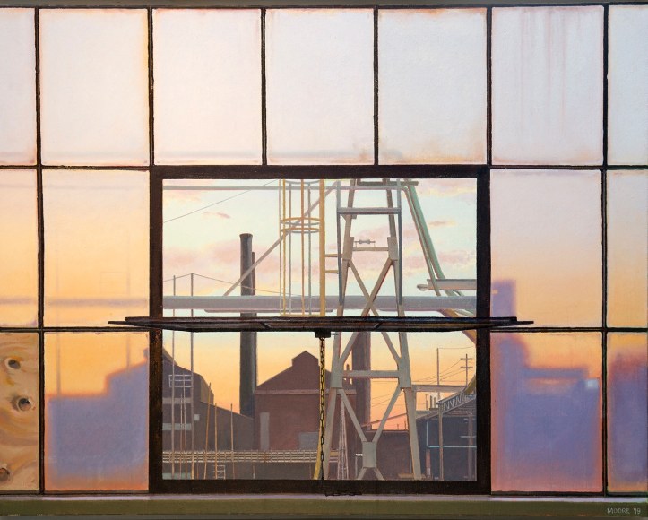 sunset through a dirty industrial window