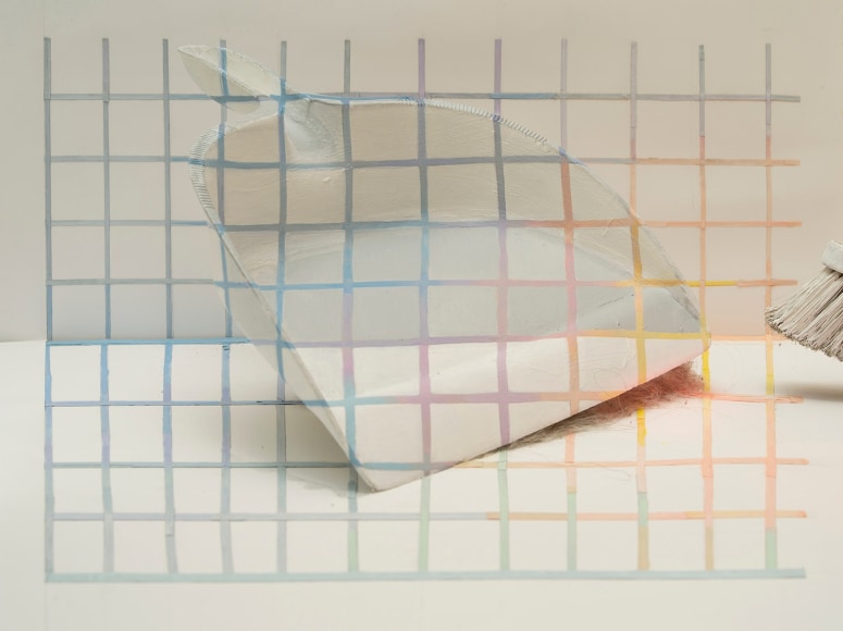 trompe l'oeil photograph of a dustpan and broom