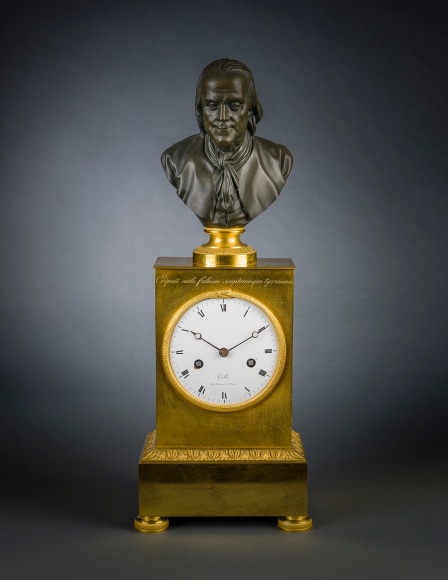 Clock in the Empire Taste with a Bust of Benjamin Franklin, about 1805&ndash;15 Case: Claude Galle (1759&ndash;1815), 60 Rue Vivienne, Paris Works: Jean-Baptiste Dubuc (1743&ndash;1819), Paris Ormolu and patinated bronze, with clockworks 19 3/4 in. high, 7 5/8 in. wide, 5 5/8 in. deep  Signed and inscribed (on front of enamel dial): Galle / Rue Vivienne &agrave; Paris; (on the back of dial): G / 38 / Dubuc / 4&ndash;[or +]6; (at top of case, front): Eripuit Coelo Fulmen Sceptrumque Tyrannis [he seized lightning from the heavens and the scepter from tyrants]
