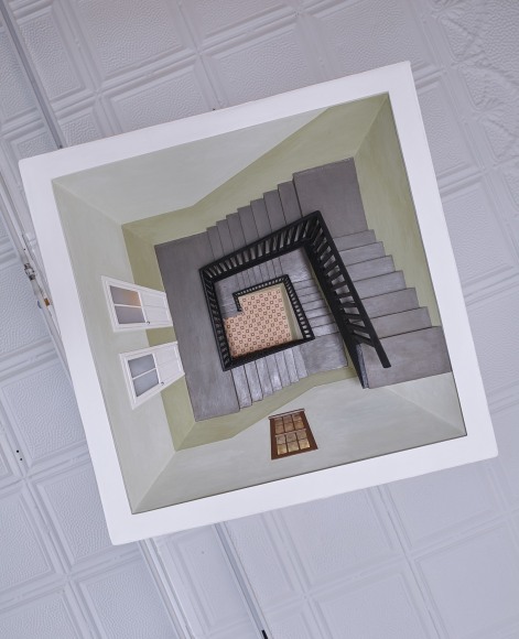 a sculpture of an overhead lamp with a descending stairwell hidden inside