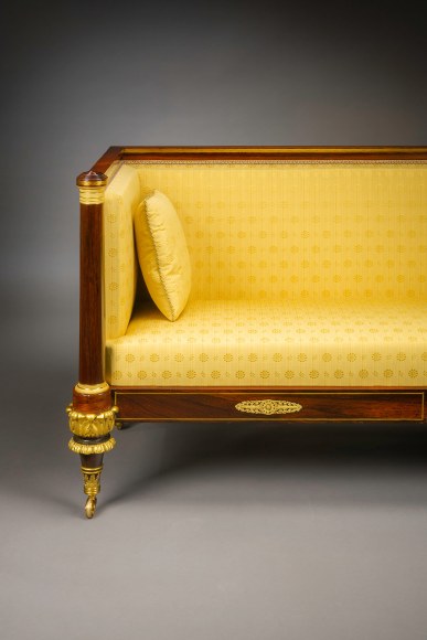 Box Sofa, about 1820. Attributed to Duncan Phyfe (1770–1854), New York. Rosewood and mahogany, partially paint-grained rosewood and gilded, brass line inlay, gilt-brass sabots and castors, and upholstery, 33 3/4 in. high, 82 in. long, 27 1/4 in. deep (detail).