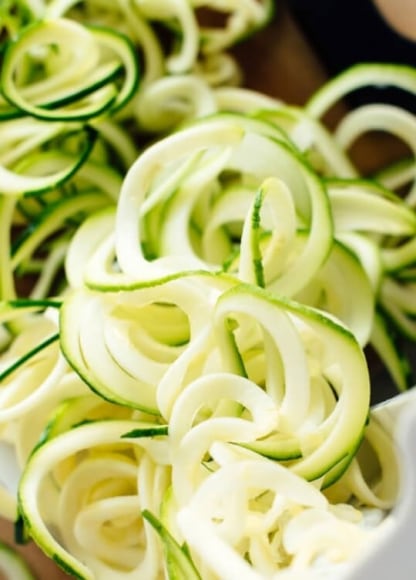 Zucchini noodles can be easily and quickly made from farmers' market zucchini on an inexpensive mandolin