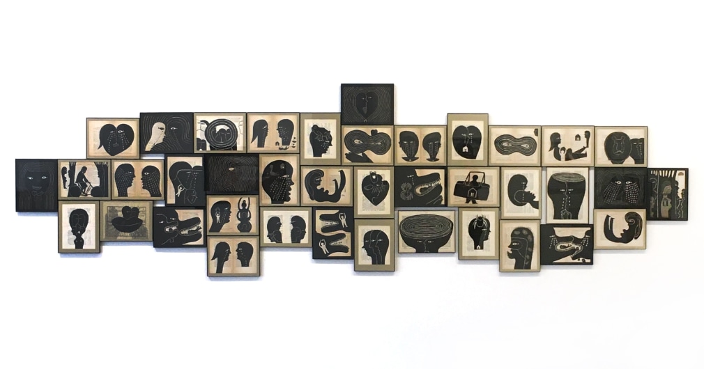 Multi work installation of small drawings on book pages, by Yen-Hua Lee