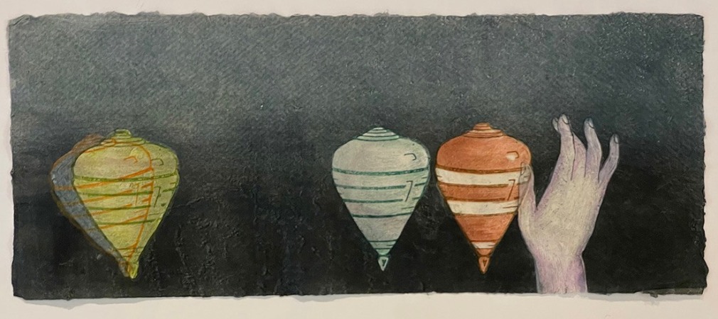 Enchant, 2021  Monotype on handmade paper  11h x 26 1/2w in, Framed: 15h x 30w in, print, dark blue background with spinning tops (of various colors) and a hand