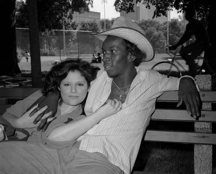 Black and white photograph of 70's couple on a park bench, by Mike Smith