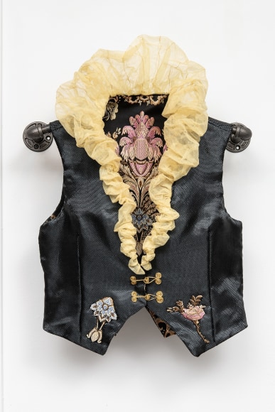 Black Kevlar vest with yellow kevlar collar, appliqu&eacute; lining. This vest is tailor-made to fit and protect Michael-Birch, a true leader within the LGBTQ+ community of Richmond.