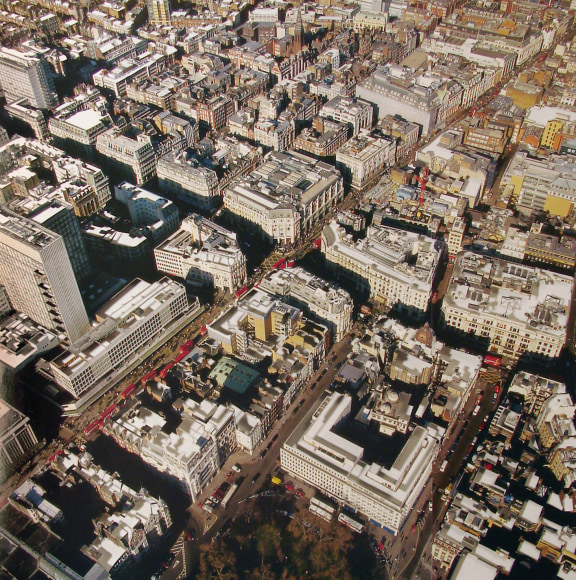 Nicholas Hall  London #2, 2012  Paper cut-out with collage  15 1/2h x 15 1/2w in, Aerial view of rooftops in London with rooftops cut out.
