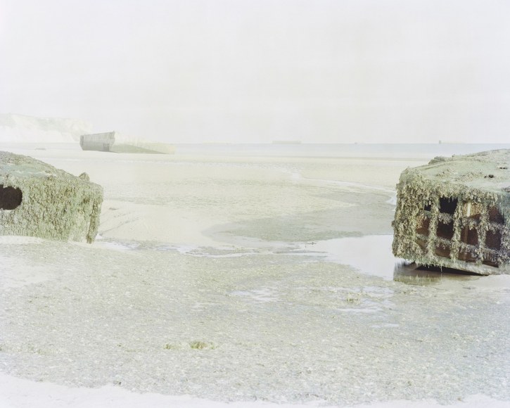 Artificial Harbor for the Invasion of Normandy (Arromanches les Bains, France), 2017  Archival pigment print  30 x 37.5 inches   Edition of 5, image of shore line in France with artificial harbor