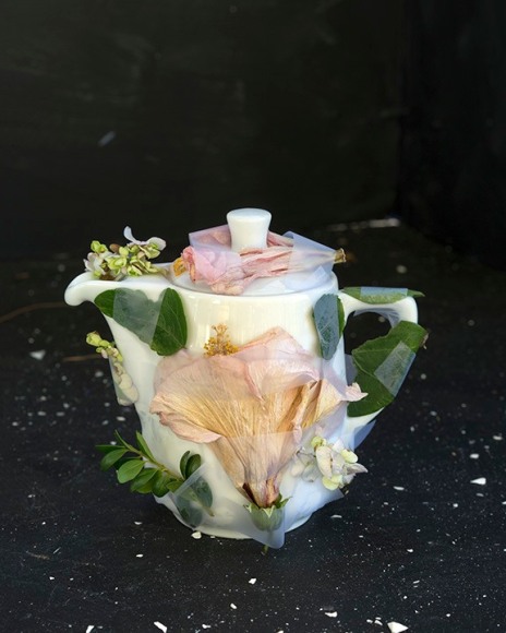 Color photograph of teapot with flowers, by James Henkel