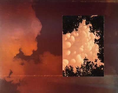 Two layered images of fluffy clouds during the sunset