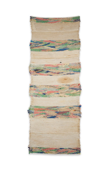 large fiberwork in muted cream and with bands of multiple primary colored lines.