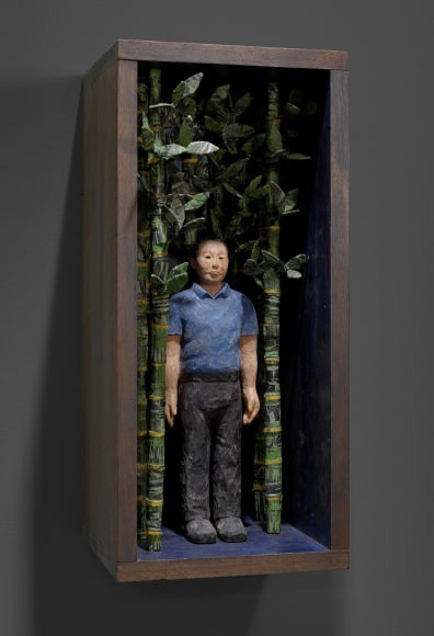 Sachiko Akiyama  In the Forest of Ghosts, 2016  Wood, Paint, Woodblock Prints, Wire  10 1/2h x 10w x 23 1/2d in. a self contained artificial ecosystem  with a figure in a bamboo like forest.