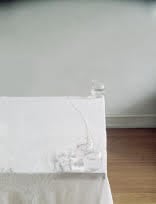 aura Letinsky  Untitled #114, from the series Hardly More Than Ever, 2003  Archival Pigment Print  32h x 25w in 81.28h x 63.50w cm  Edition of 15  LL_063, Still life image of white table cloth with water glasses/vases precariously placed on the corners of the table