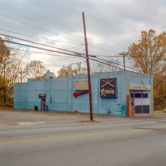 Ken Abbott  Ron's Pool Hall, Patton Ave., Asheville, November 2005, Printed 2020  Archival Pigment Print  Image Size: 7 x 7 in Paper Size: 12 x 9 1/2 in Mat Size: 14 x 11 in  Edition of 10  $ 300.00 unframed, photograph of a rundown pool hall