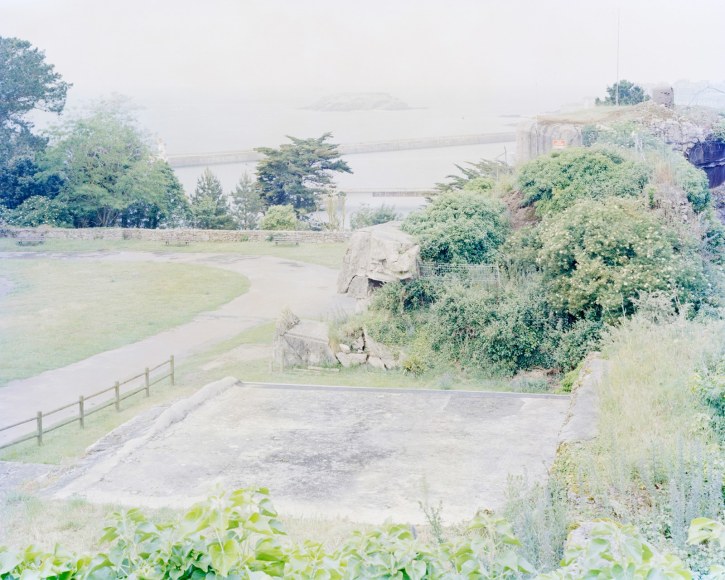 Atlantic Wall Fortifications (Cite d'Alet, St, Malo, France), 2018  Archival pigment print  30 x 37.5 inches  Edition of 5, photograph of gardens and coastline with exposed foundations and wall fortifications