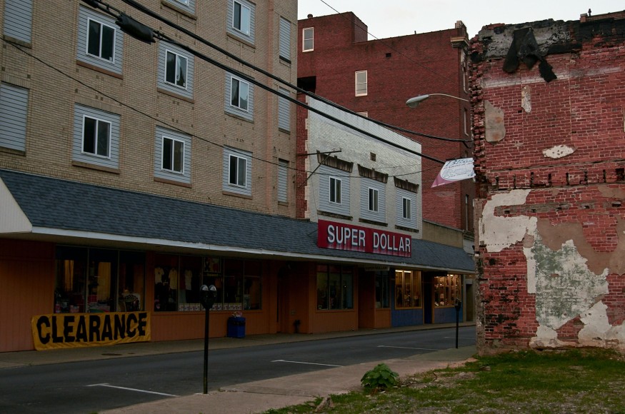 Stacy Kranitz  Logan, West Virginia, 2013  Archival Pigment Print16h x 24w inches, Edition of 5  30 x 40 inches, Edition of 3, exterior street scene of a dollar store in West Virginia,