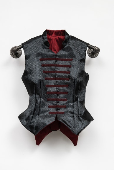 Black tailored vest, Using black bulletproof Kevlar material and a dark red silk lining, this vest is tailor-made to fit and protect Francis, one of my three interns during a 2018 residency at&nbsp;Platte Forum&nbsp;in Denver.