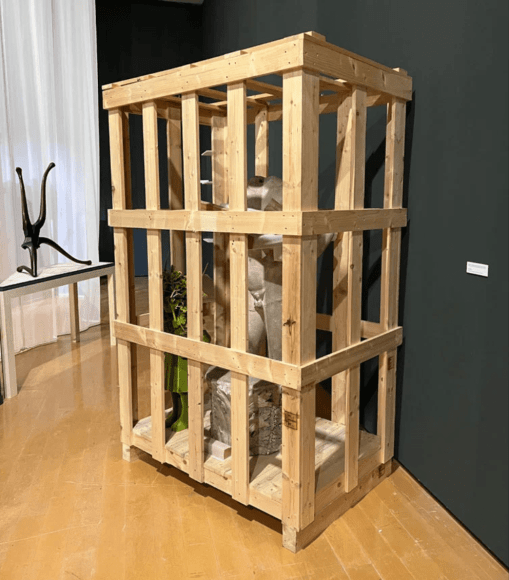 A sculpture by Kim Simonsson and a marble statue of Apollo are displayed together at the 2022 Lyon Biennale.