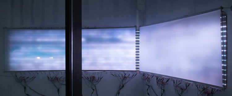 David Bowen &quot;waveline&quot; video on three LED screens with water data on opposite sides of the world