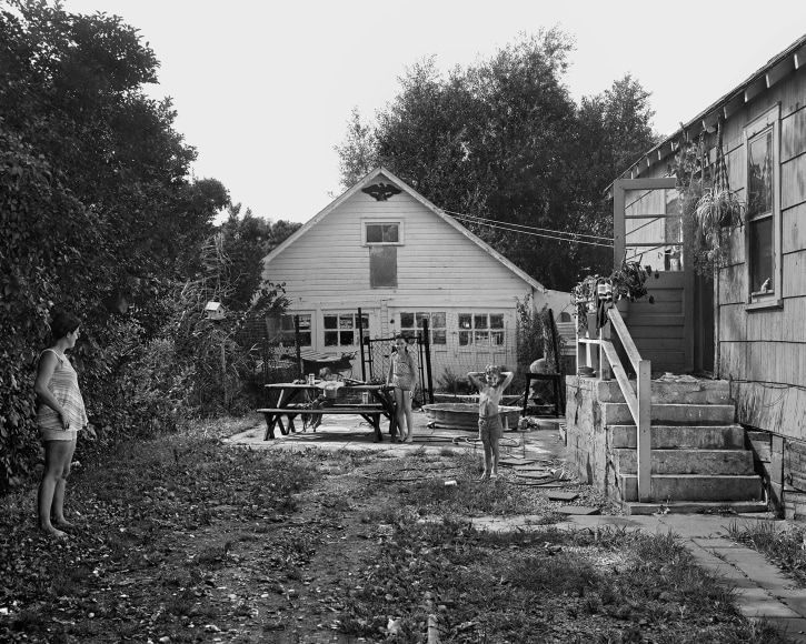 Woman and Children in their Yard