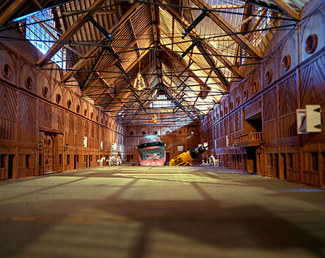 Man working on miniature barn, Shelburne, VT, 2004