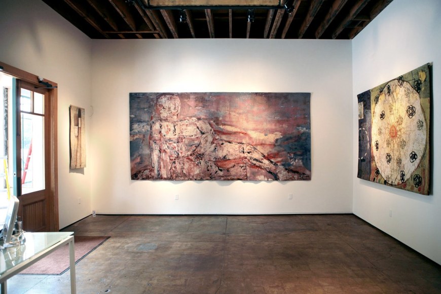 Installation photograph of Tapestries exhibition, Alan Magee, Leon Golub, Squeak Carnwath