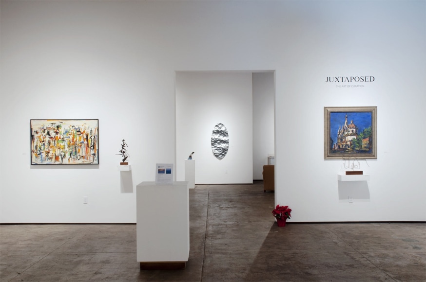 Installation photograph of JUXTAPOSED: The Art of Curation with works by Wosene Worke Kosrof, Sidney Gordin, and Dan Lutz, with Alex Rasmussen in the background
