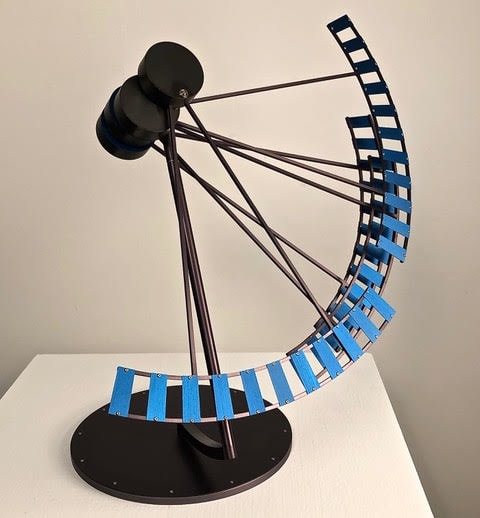 Pedro S. de Movell&aacute;n,&nbsp;TRACER, 2020. Titanium anodized aluminum, Blue anodized aluminum, blackened brass, stainless steel, 21 x 20 &frac12; in.&nbsp;[Maximum Swing] (53.3 x 52.1 cm.)