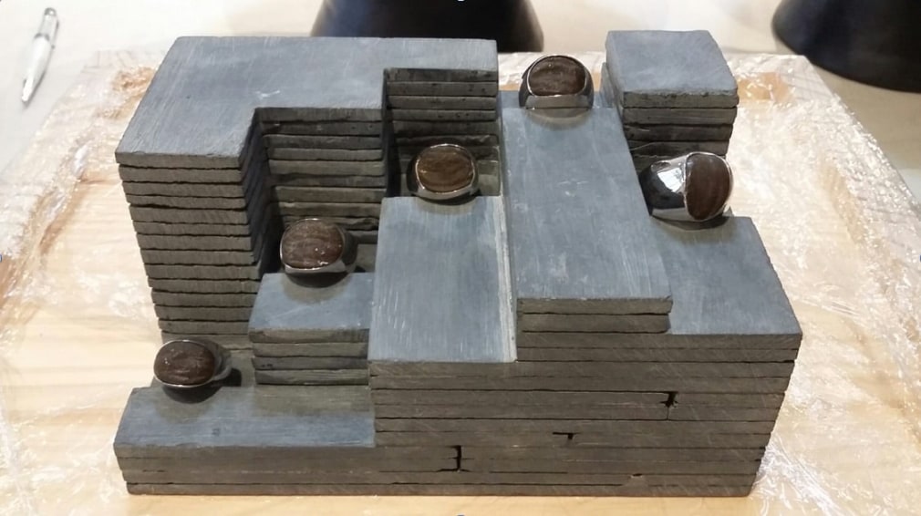 Miguel &Aacute;ngel Rojas. Sendero. Ed. 1/3 [Edition of 3 + 2 AP], 2015. Black stone, silver, resin and mambe, 2 3/4 x 6 11/16 x 4 1/2 in. (7 x 17 x 11.4 cm.)