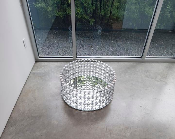 Pedro Tyler, Manantial, 2010. Aluminum rulers and mirror, 15 3/4 x 27 1/2 in.