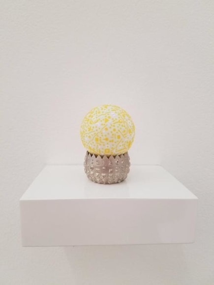 Marco Maggi, Language in Residence, 2017.&nbsp;Paper cuts on pong pong ball at IBM Selectric font ball, 3 1/2 x 4 1/8 x 3 in. / 8.9 x 10.5 x 7.6 cm.