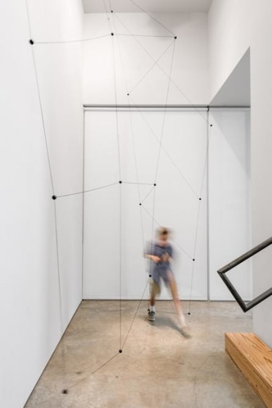 Magdalena Fern&aacute;ndez, 1ee016, 2016. Iron spheres with black elastic cord, 90 1/2 x 68 1/2 x 18 7/8 in. &copy; Peter Molick