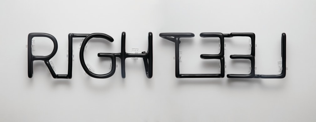 Gabriel de la Mora, RIGHT - LEFT, 2017. Hand-carved Obsidian, 5 11/16 x 32 5/8 x 2 1/8 in. (14.5 x 83 x 5.5 cm.)