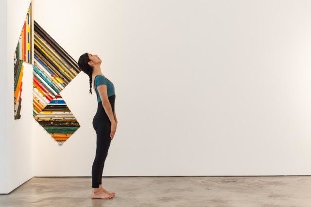 Laura Gutierrez at Sicardi Gallery, with Esvin Alarc&oacute;n Lam, Displacement No. 5, 2015. Photograph by Lynn Lane.