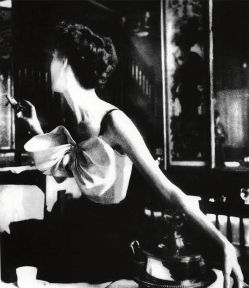 Lillian Bassman  Across the Restaurant, Barbara Mullen, dress by Jacques Fath, Le Grand Véfour, Paris, 1949 