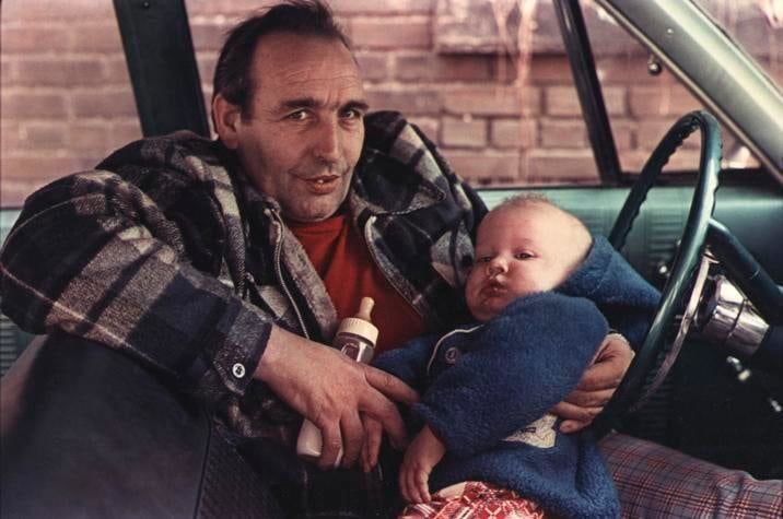 Man by Red Shirt in Car with Baby. Wilkes-Barre, PA. 1977.