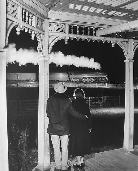 Mr. and Mrs. Ben Pope watch the last steam powered passenger train.  Max Meadows, Virginia 1958
