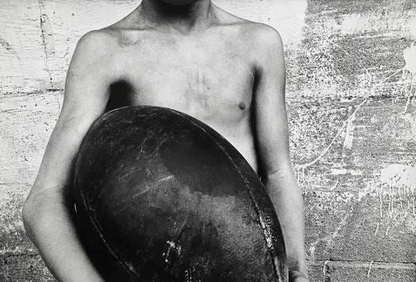 Boy and Football, 1974, 	16 x 20 inch gelatin silver print