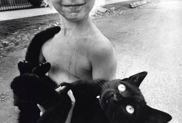Boy and Black Cat, 1977, 	16 x 20 inch gelatin silver print