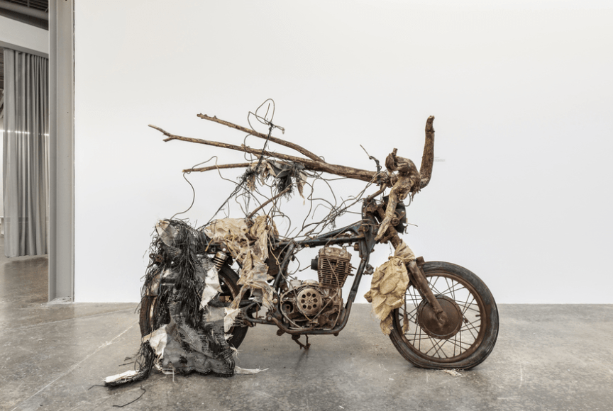 Lonnie Holley,&nbsp;Riding Through My Roots Too Fast, 2004, Old motorcycle frame, found wood, 59 &times; 77 inches, Courtesy of James Fuentes, New York and The Brant Foundation.