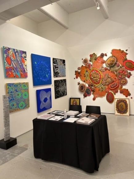 Works by Jody Rasch on left wall