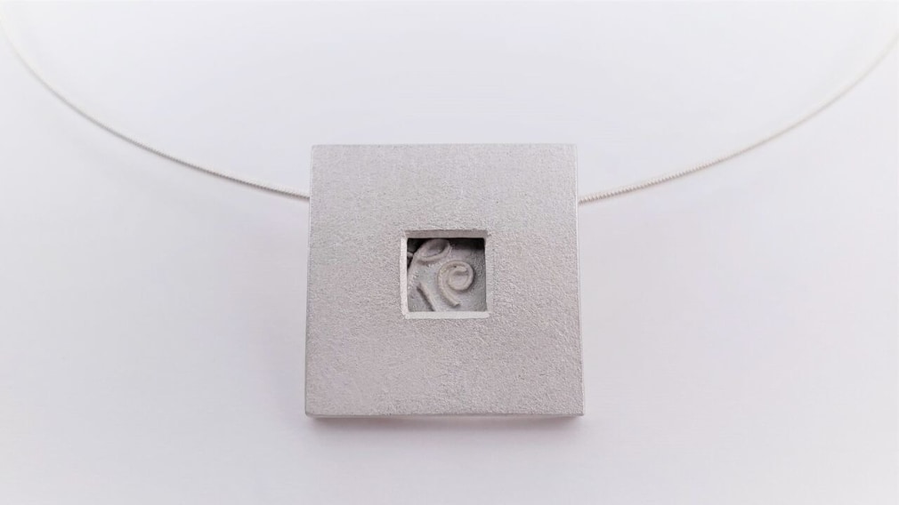 Ann Parkin, Pendant on neck wire - Particle Box #1